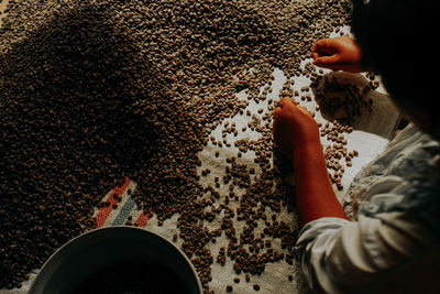 High angle view of man buying lentils in shop