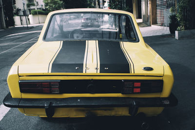Close-up of car on road