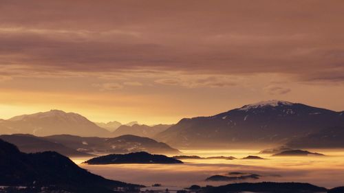 Scenic view of mountains against sky during sunset