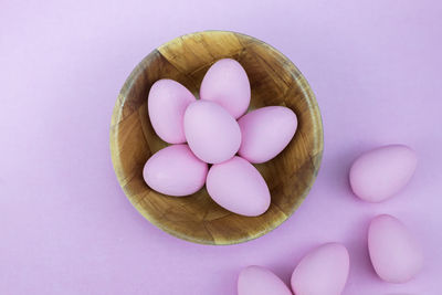 High angle view of pink eggs against white background
