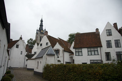 Panoramic view of houses and buildings against sky