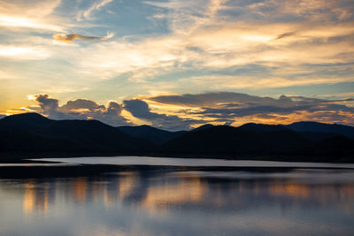 Scenic view of lake against sky during sunset