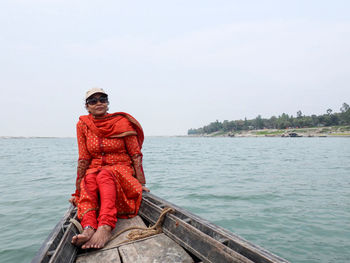 Portrait of man in sea against clear sky