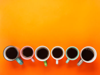 Directly above shot of candies against orange background