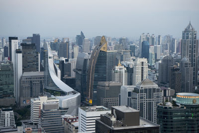 High angle view of modern buildings against sky in city