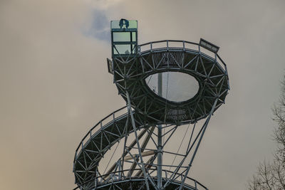 Low angle view of electricity pylon against sky