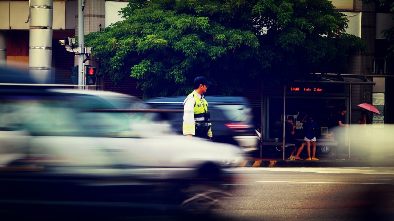 transportation, lifestyles, blurred motion, motion, mode of transport, full length, land vehicle, men, leisure activity, on the move, rear view, road, street, speed, car, travel, person, city life