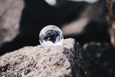 Glass bal on a stone