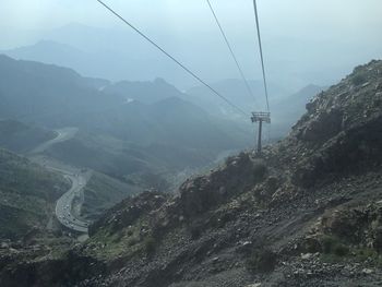 High angle view of overhead cable car against mountains