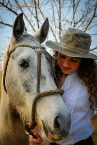 Portrait of young woman wearing hat