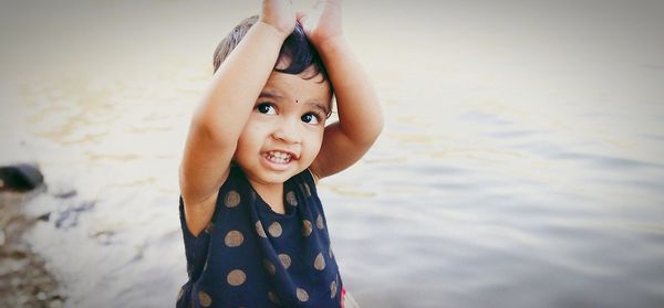 Portrait of happy girl in water