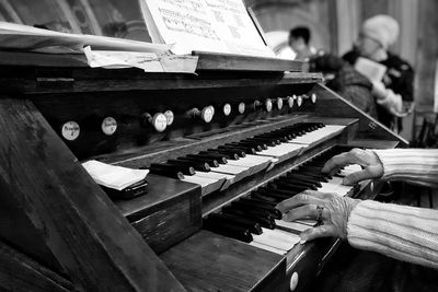 Close-up of man playing piano