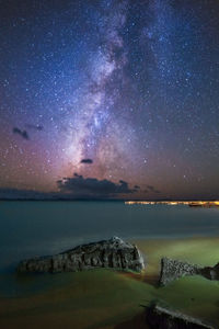 Scenic view of sea against sky at night