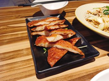 High angle view of meat in plate on table