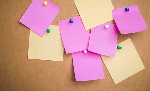 Close-up of sticky notes on cardboard box