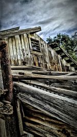 Low angle view of built structure against cloudy sky