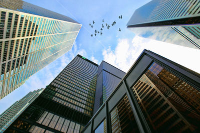 Low angle view of modern buildings against sky