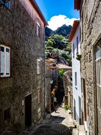 Narrow alley amidst buildings in town