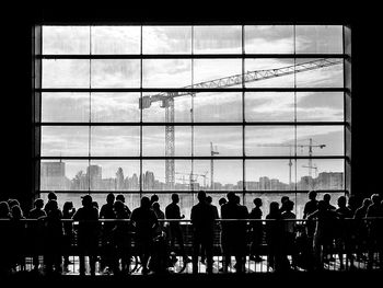 Silhouette of people in window