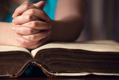 Close-up of hand holding book