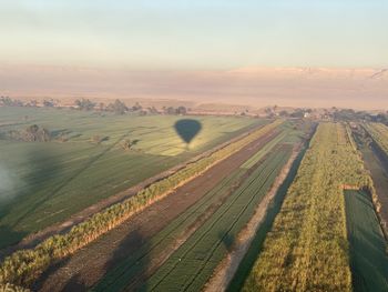 Aerial view of agricultural field against sky