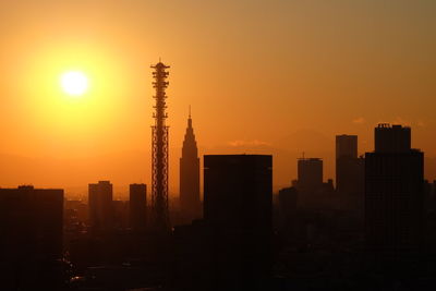 Silhouette of buildings during sunset