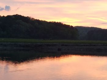 Scenic view of landscape against sky during sunset