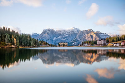 Scenic view of lake and mountains against sky