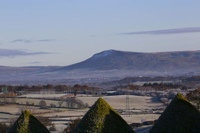 Scenic view of landscape and mountains against sky