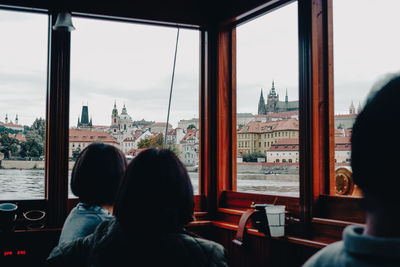 Rear view of people traveling in city