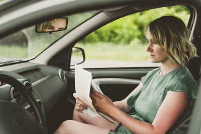 Woman sitting in car