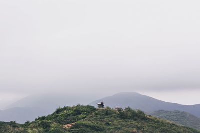 Countryside landscape against clear sky