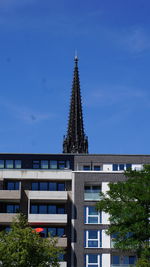 Low angle view of building against blue sky