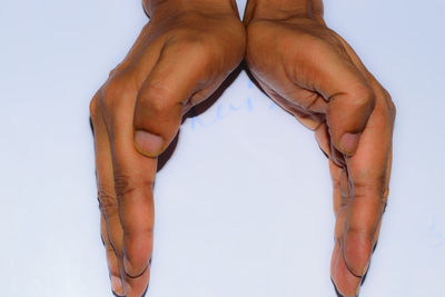 Midsection of woman against white background