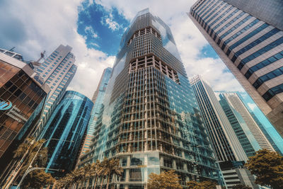 Low angle view of modern buildings against sky in city