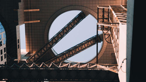 Low angle view of bridge connecting two buildings in city 