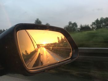 Reflection of car on side-view mirror