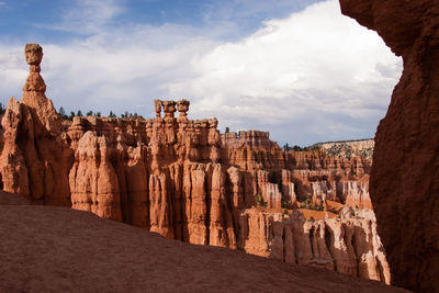 Panoramic view of rock formations against sky