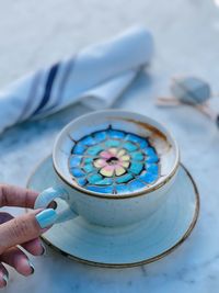 Close-up of hand holding coffee