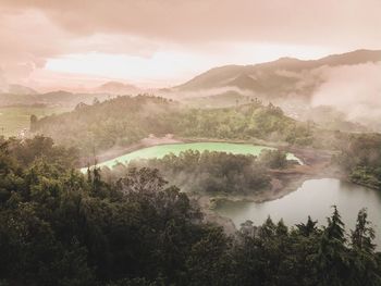 High angle view of trees and mountains against sky