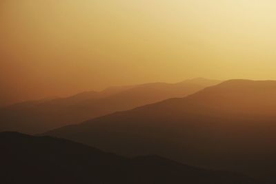 Scenic view of mountains at sunset