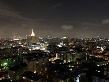 High angle view of city lit up at night