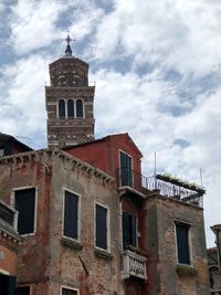 Low angle view of old building against sky