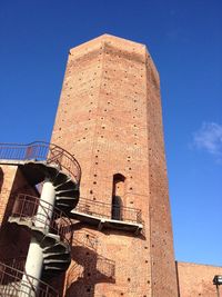 Low angle view of built structure against blue sky