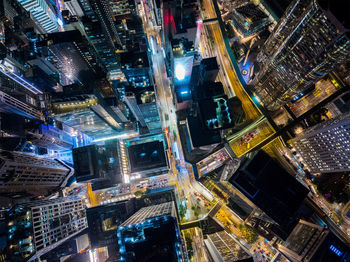 High angle view of illuminated buildings in city at night