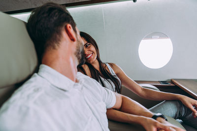 Young couple sitting in bus