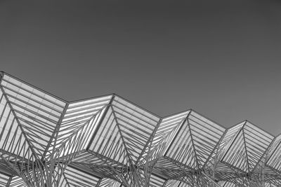 Low angle view of office building against clear sky