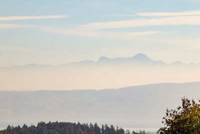 Scenic view of silhouette mountains against sky during sunset