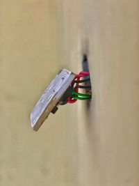 Close-up of clothespins hanging on wall