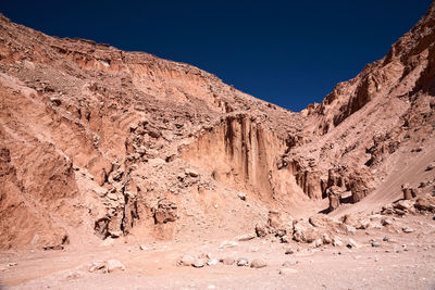 Scenic view of mountains against clear blue sky